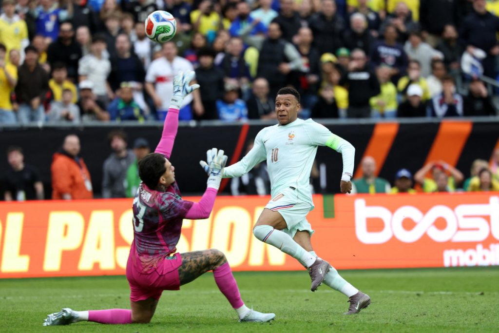 Mbappe scores as France shrug off red card to beat Brazil