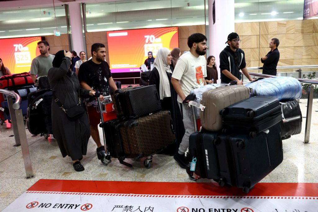 Drones fall near Dubai airport, ships hit as Iran presses on with attacks