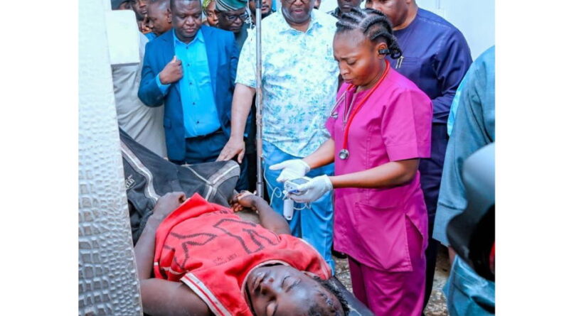 Plateau State Governor Caleb Mutfwang checks on injured victims receiving treatment at the Jos University Teaching Hospital.