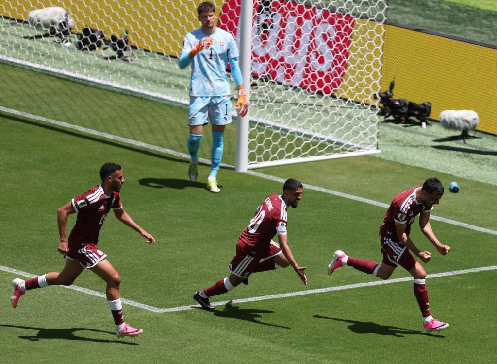 Qatar earn first ever World Cup point with late goal