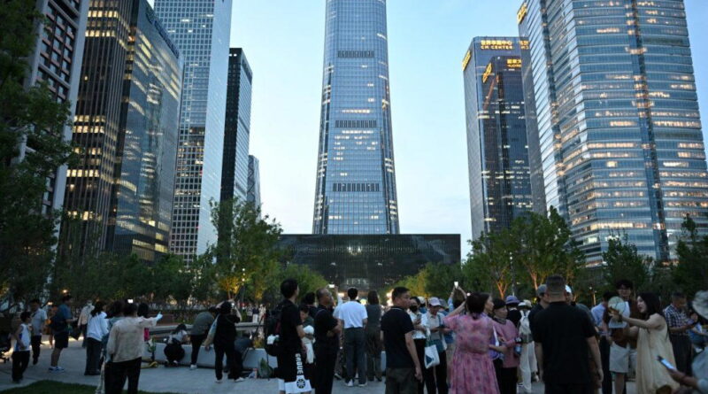 Pilot killed, 13 injured as small plane crashes into Beijing skyscraper