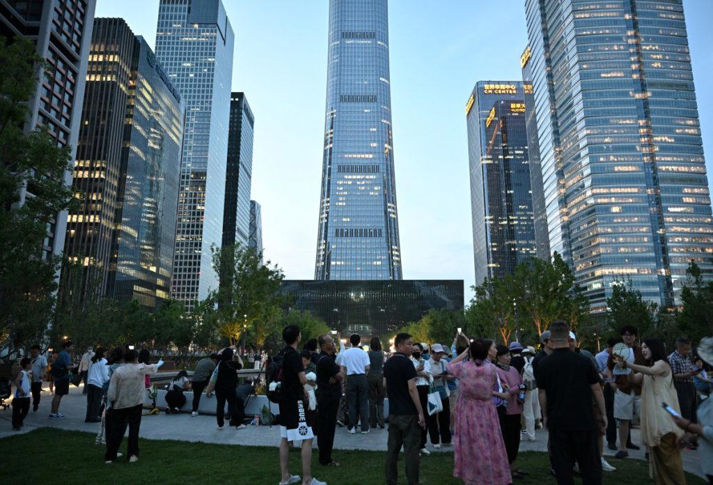 Pilot killed, 13 injured as small plane crashes into Beijing skyscraper