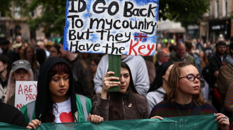 Thousands turn out for anti-racism rally after Belfast unrest
