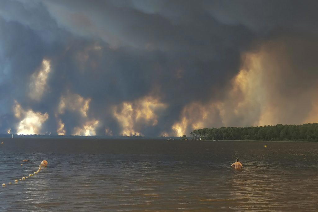 More than 160,000 flee out-of-control wildfires in France, Spain