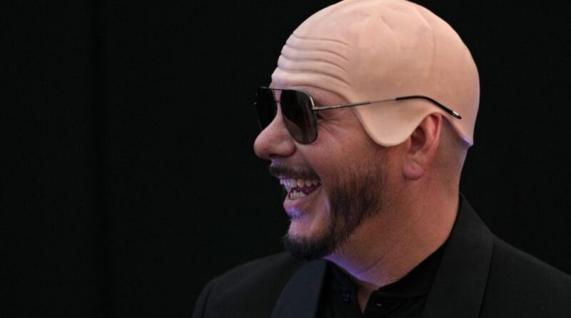 US rapper Pitbull sets bald cap world record at London show